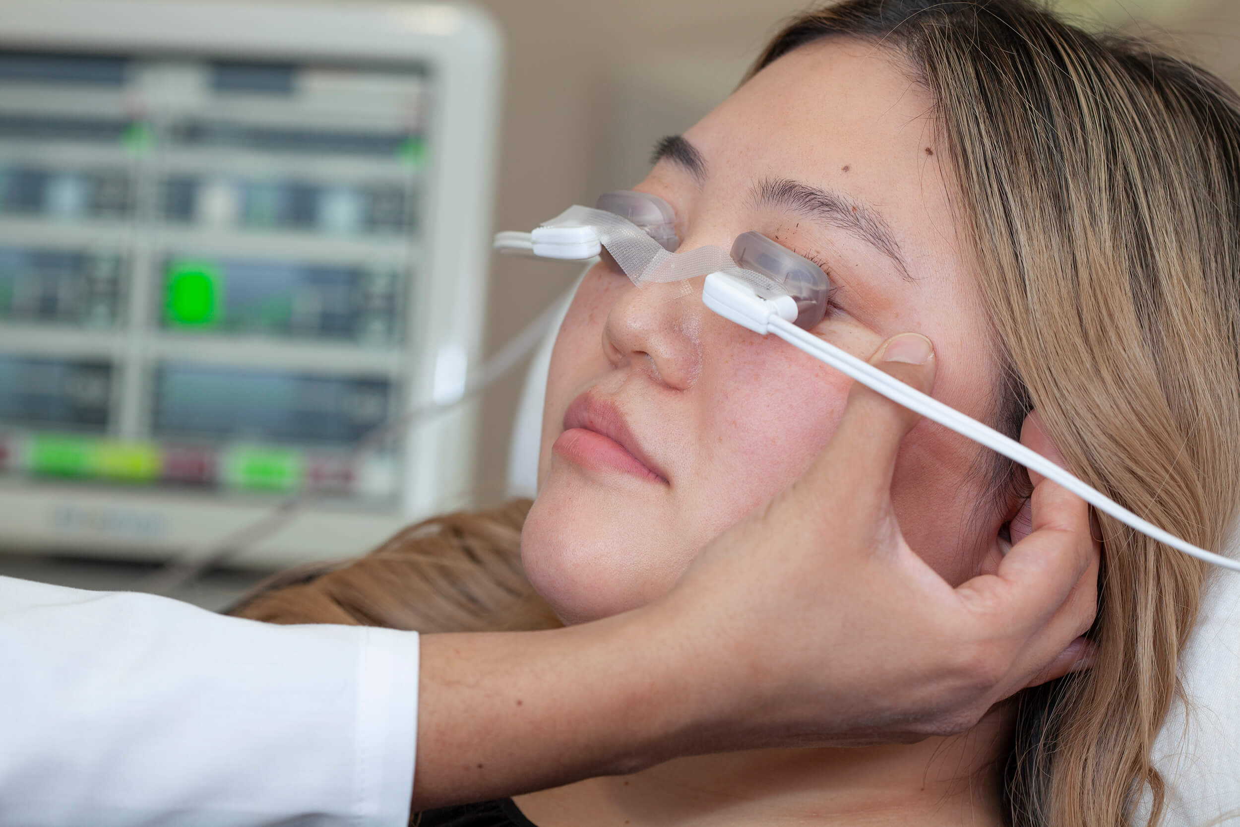 A woman in the process of LipiFlow treatment. 