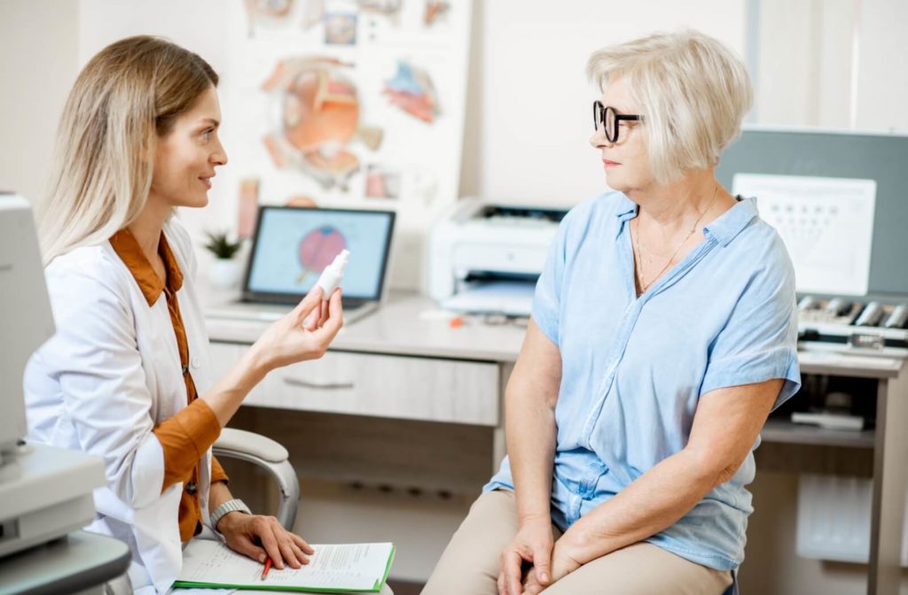 An optometrist discussing dry eye therapy options with their patient during their dry eye consultation.