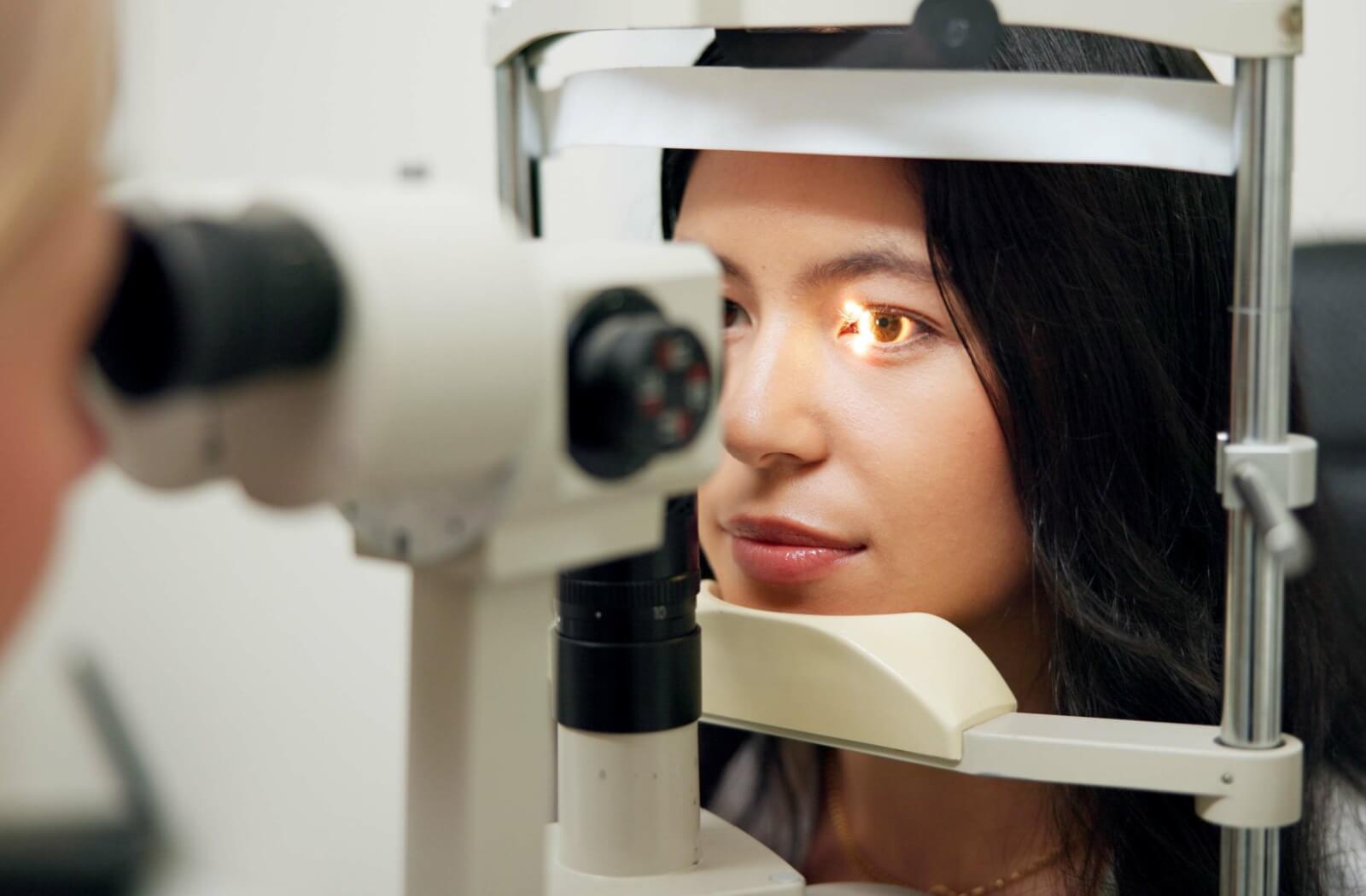 Woman undergoing a detailed eye exam